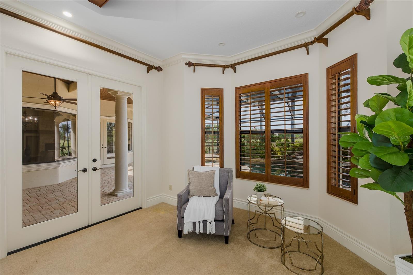 Sitting Area in Primary w/Atrium Doors to Lanai