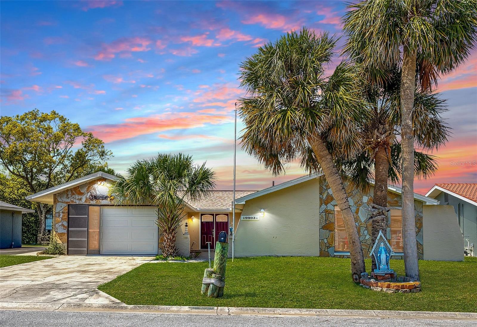 Front View, 3 bed, 2 bath Canal home at 9903 San Mateo Way, Port Richey, FL 34668