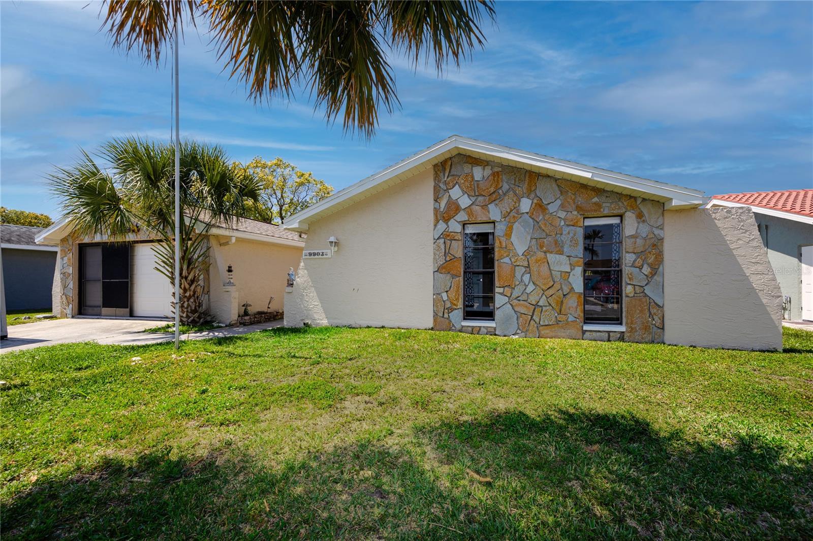 Front View, 3 bed, 2 bath Canal home at 9903 San Mateo Way, Port Richey, FL 34668