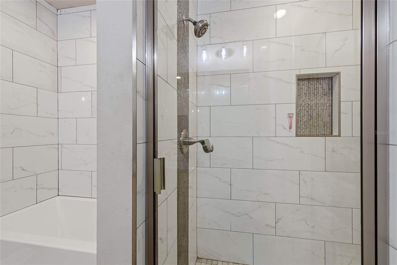 Glass enclosed walk in shower