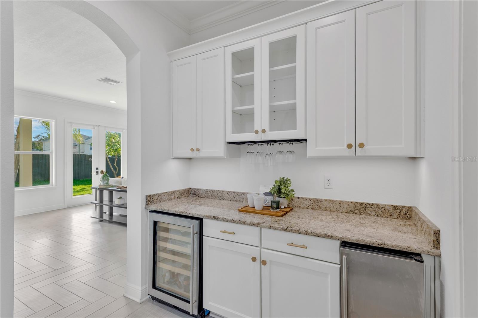 Bulter's pantry with wine fridge and icemaker