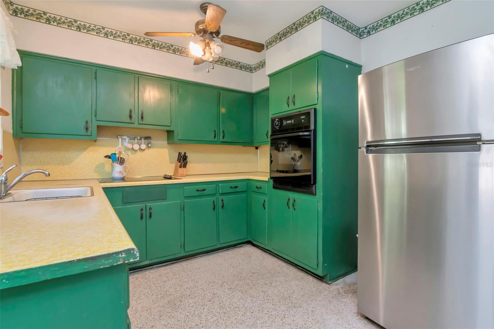 Built in oven and stainless fridge included.