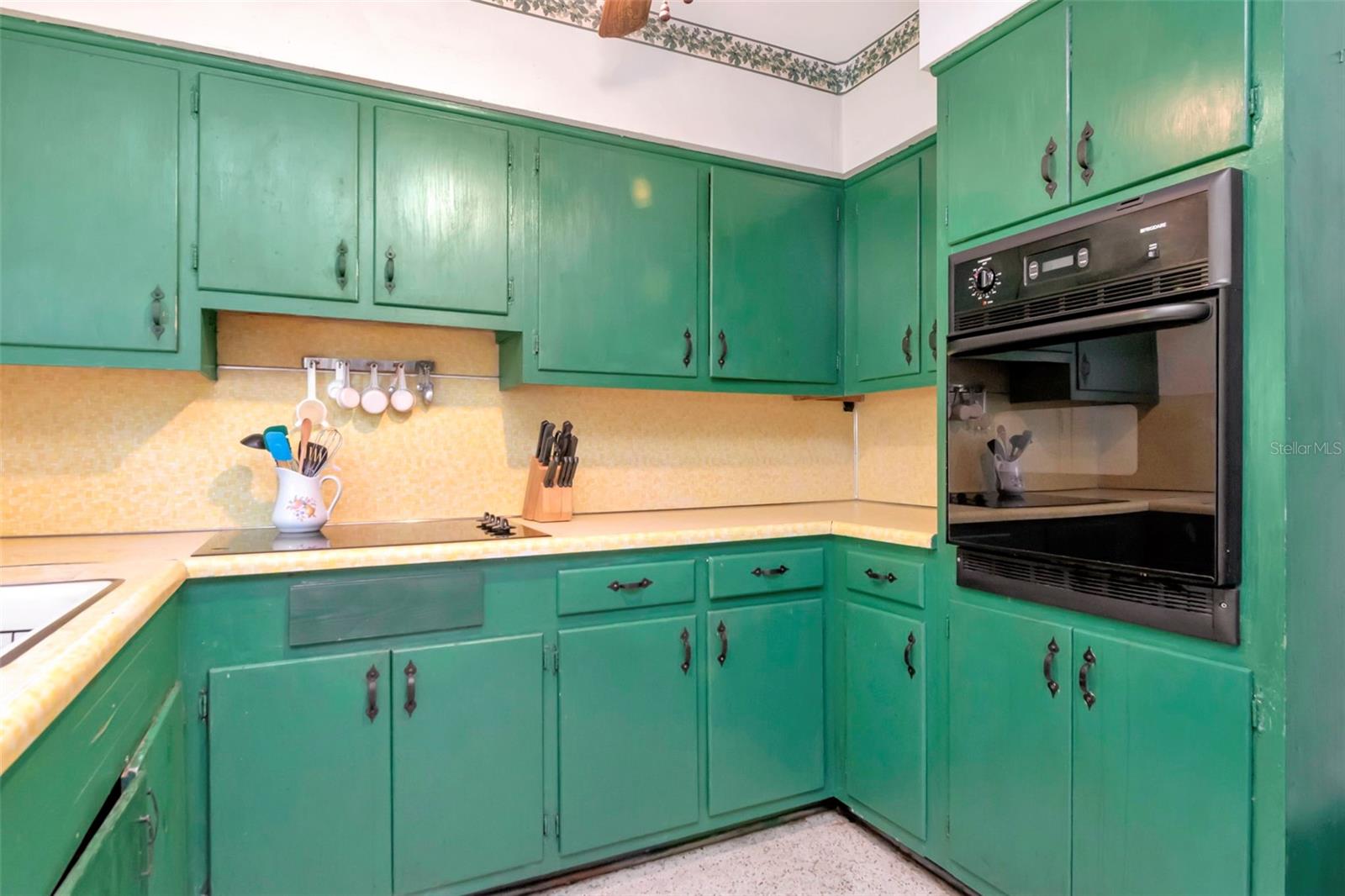 Anothe rangle of the kitchen and flat top stove.