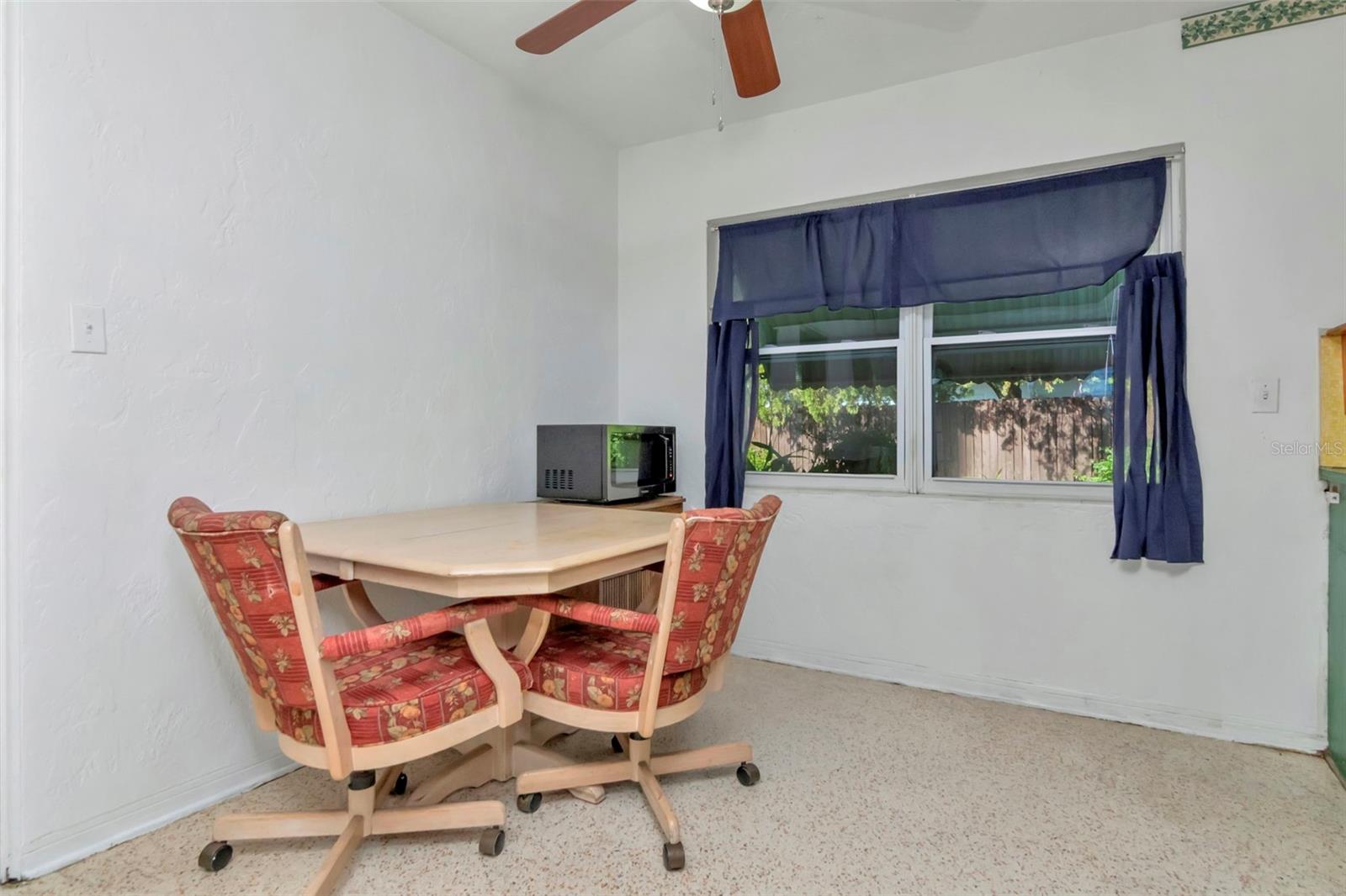 Another view of the eat in kitchen area.  Still has the original terrazo flooring.