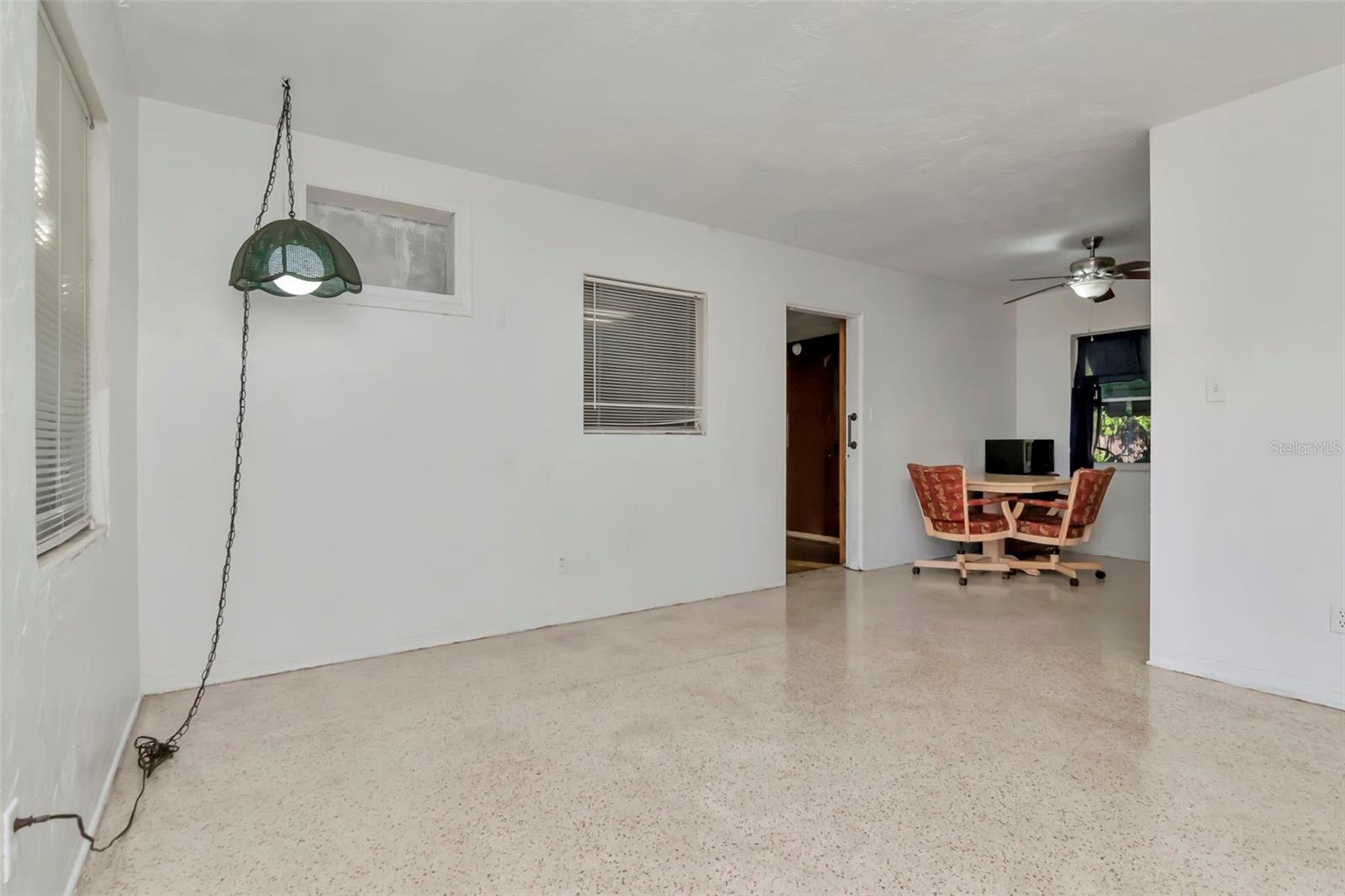 Family room and view into the kitchen and bonus room.