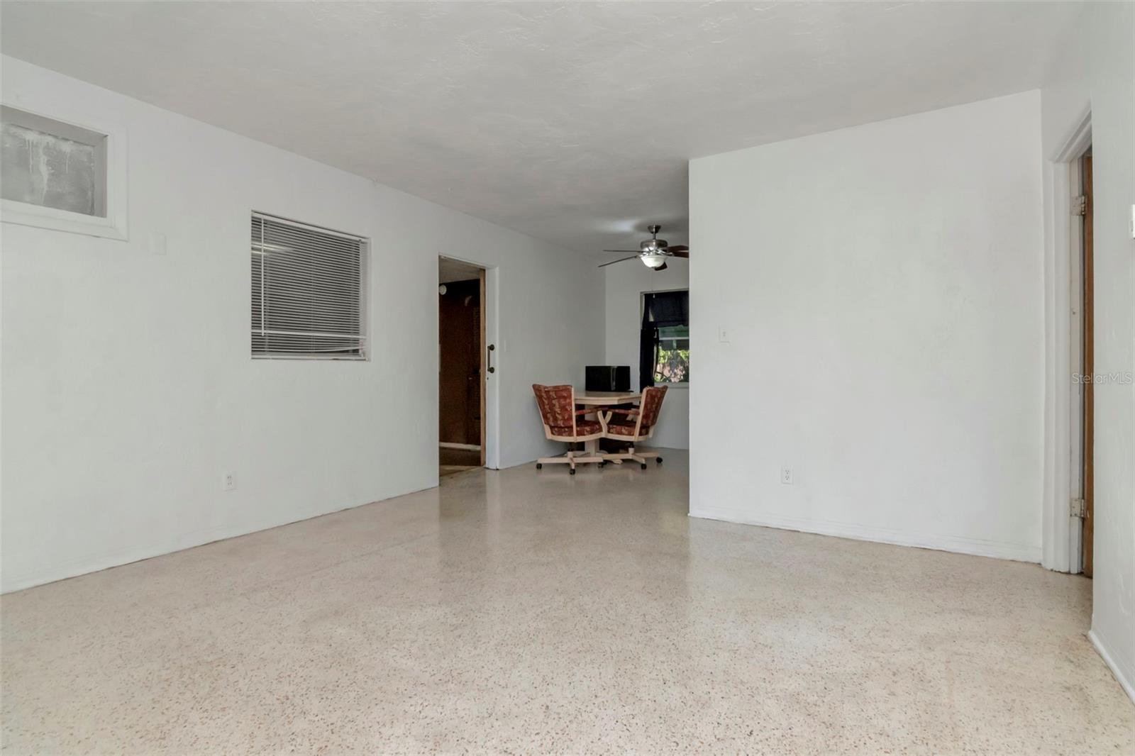 Main family room and view into the kitchen and bonus room.
