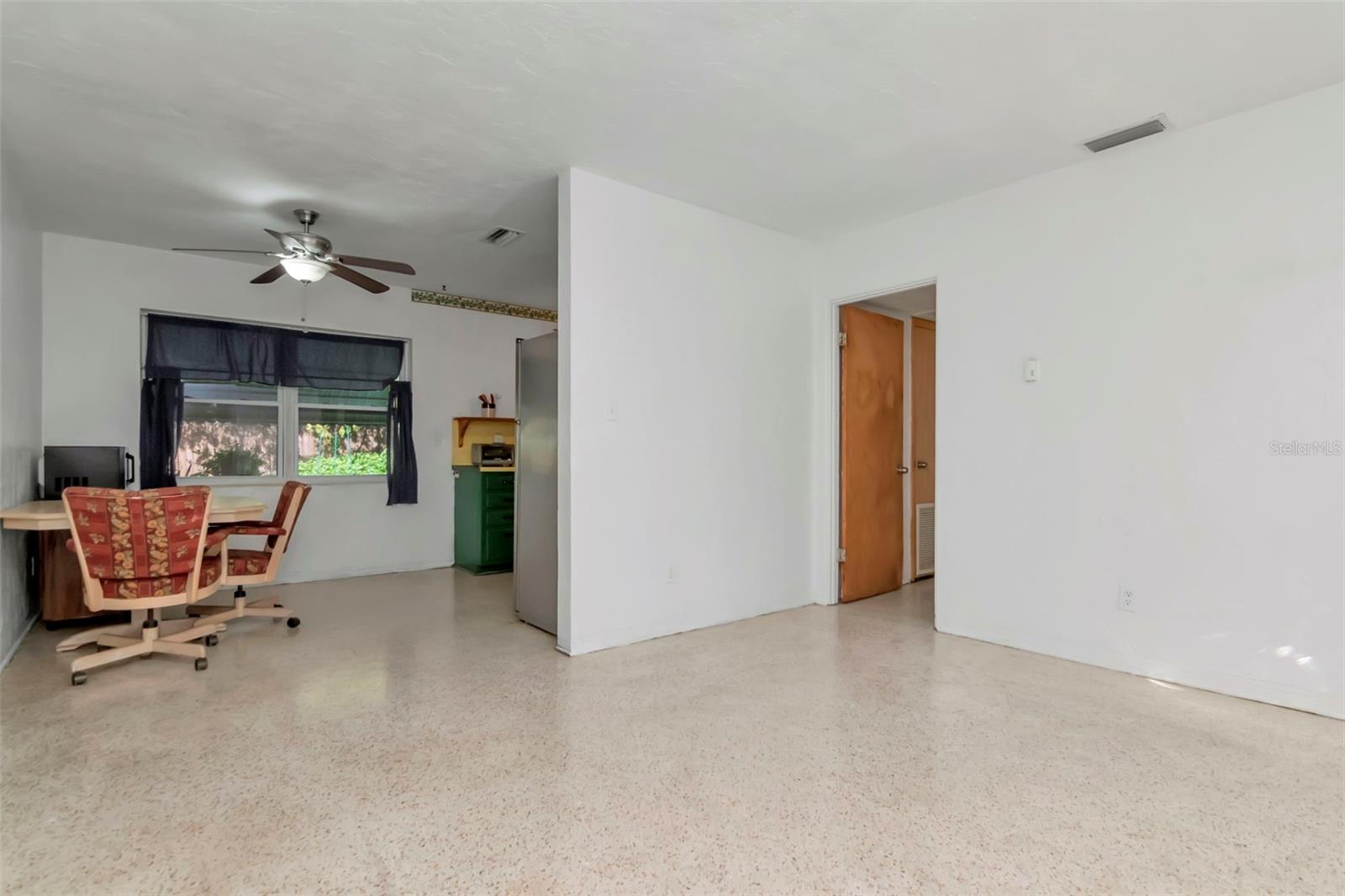 View into the kitchen and hallway to the bed and bath.