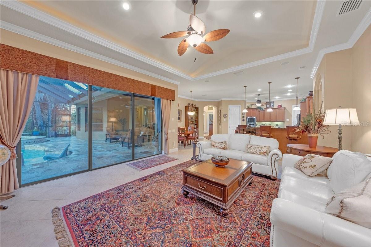 Pocket sliding doors opening to the lanai for seamless indoor-outdoor flow.