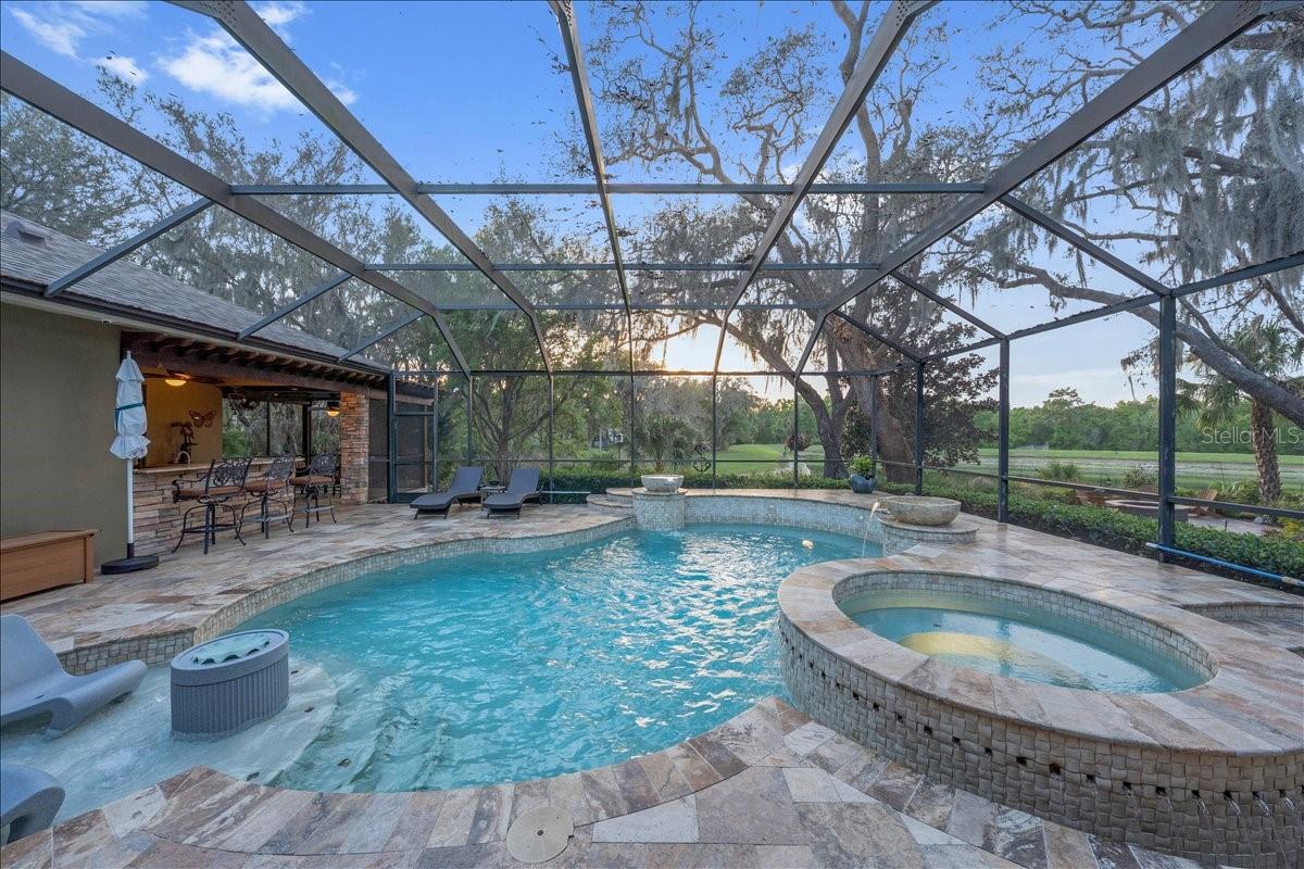 Solar-heated saltwater pool with spa.