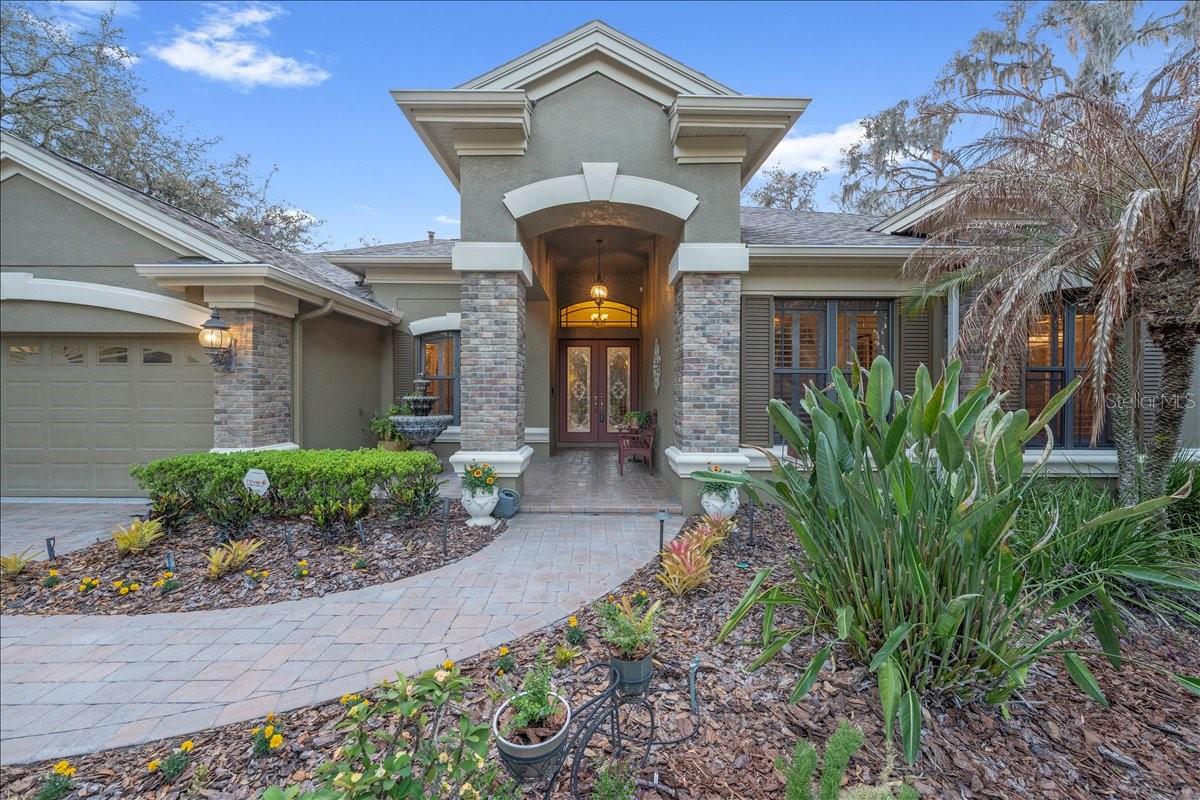 Beautiful curb appeal on a premium .53-acre pie-shaped cul-de-sac lot.