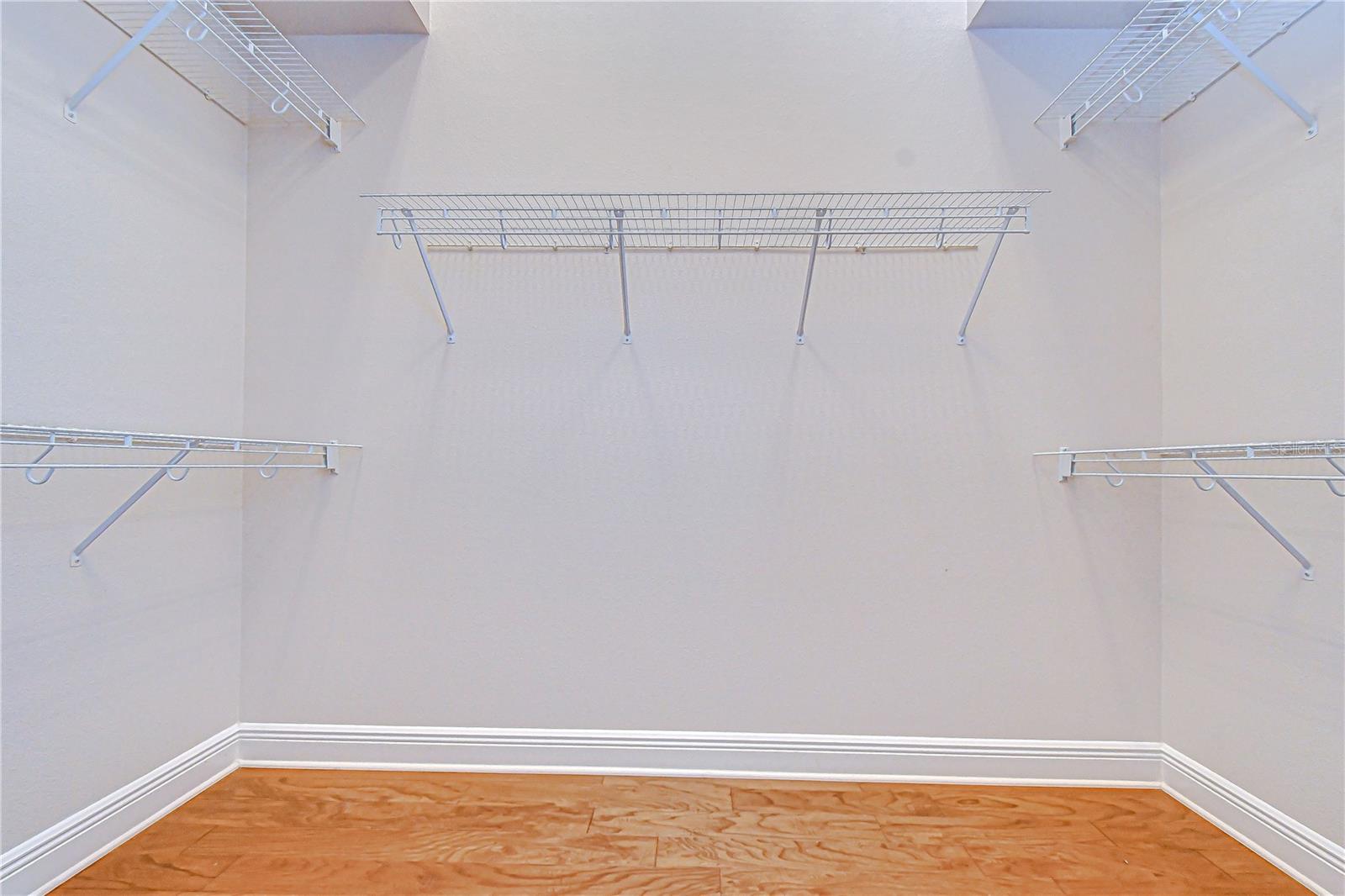 1 of 2 Walk-in Closets in Primary