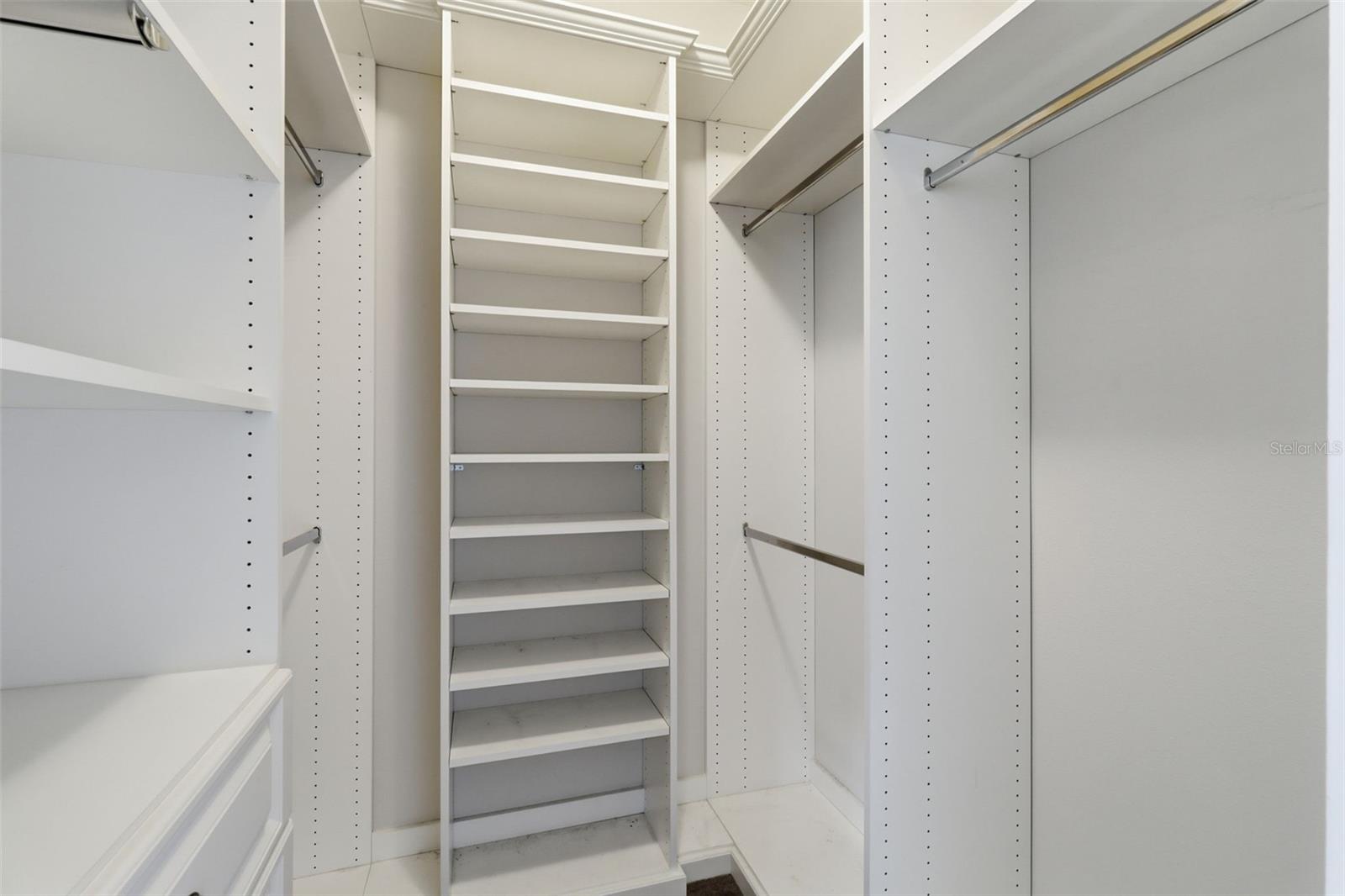 A closet that finally makes sense Custom shelving, dedicated space, and room for everything—this primary suite delivers the organization you’ve been dreaming of. One of two in the primary suite.