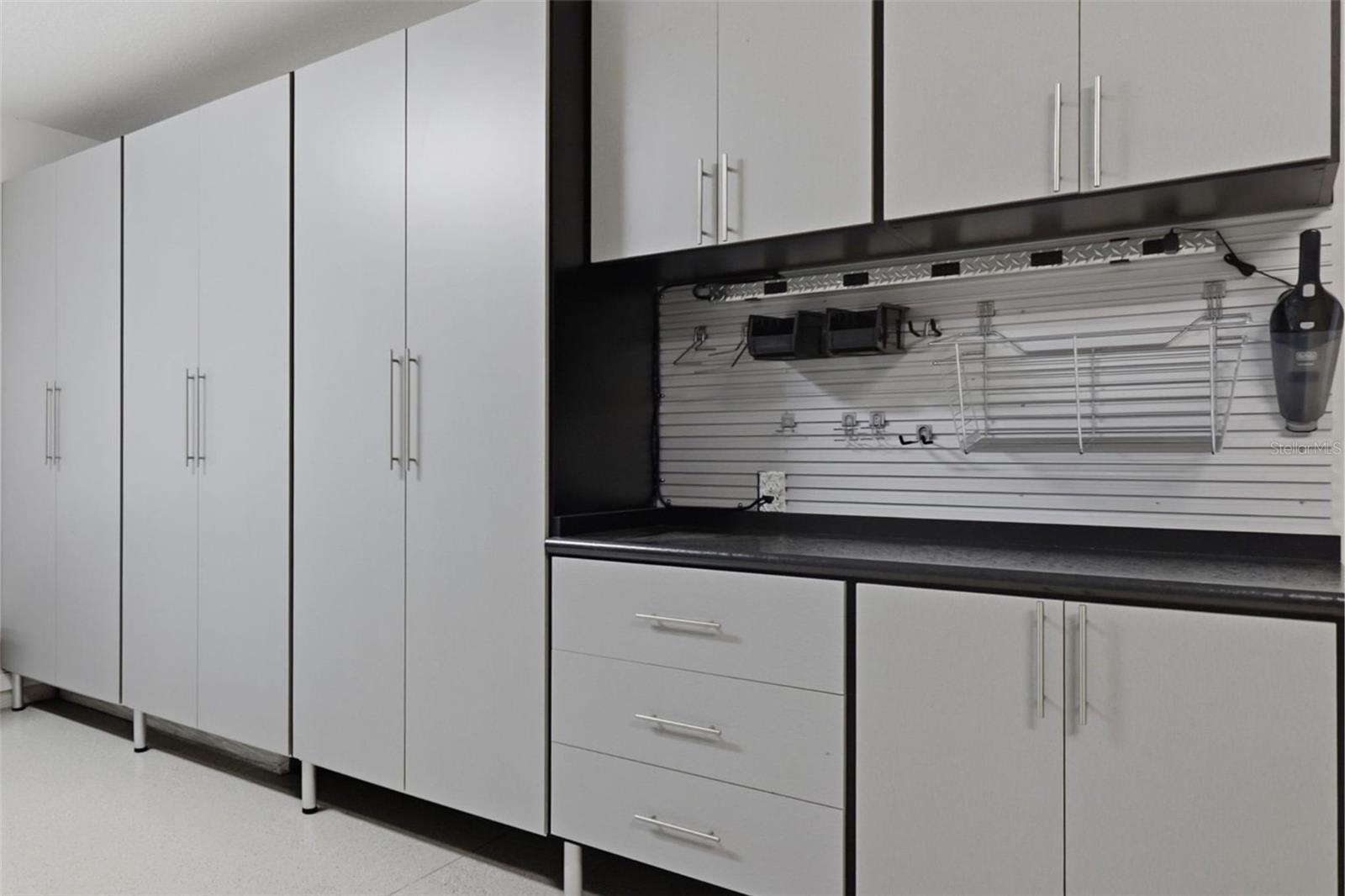 This isn’t just a garage… it’s a dream setup ??Custom cabinetry, built-in workspace, and sleek epoxy flooring make this space as functional as it is clean.