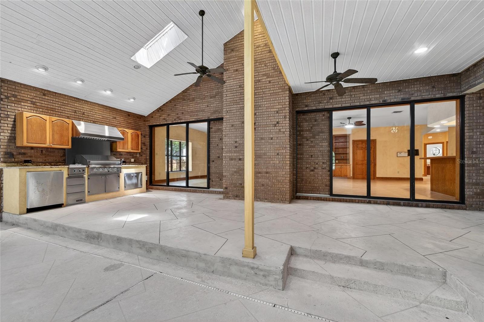 Pool area with kitchen and access to Great Room via (2) sets of pocket sliders