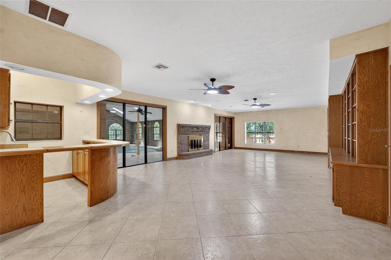 Great room with wood-burning fireplace & wer-bar