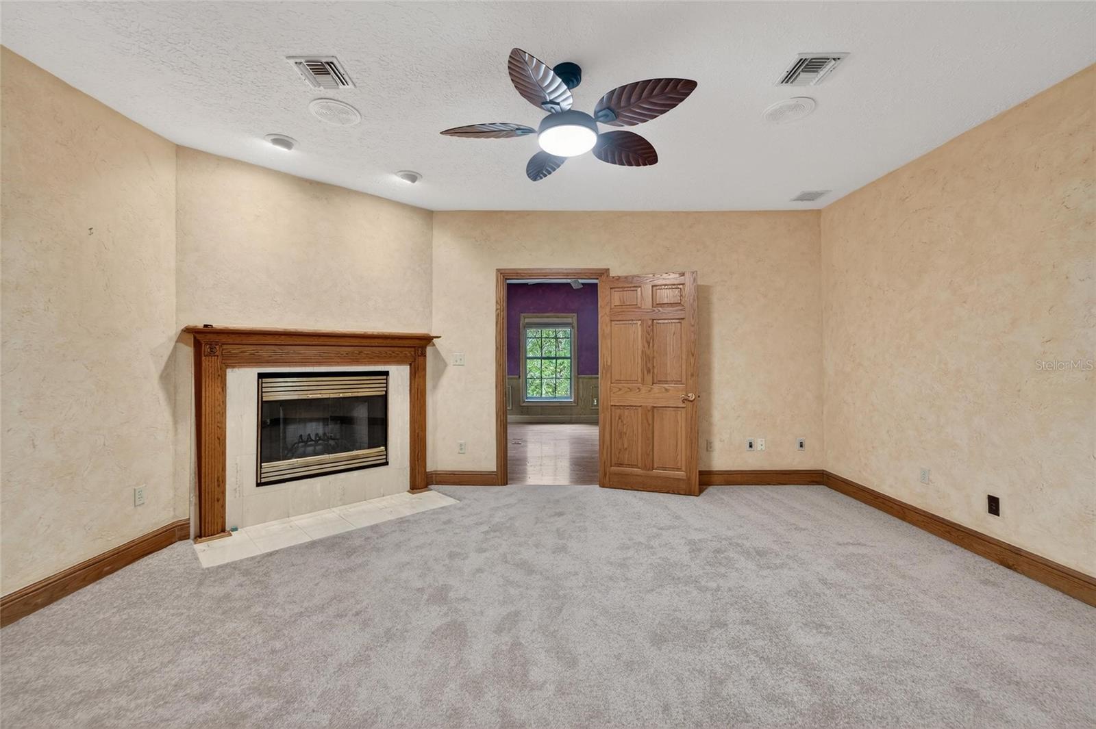 Wood-burning fireplace in (secondary) bedroom