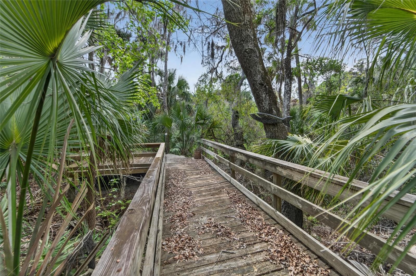 Private wood-bridge leading to your Alafia River access