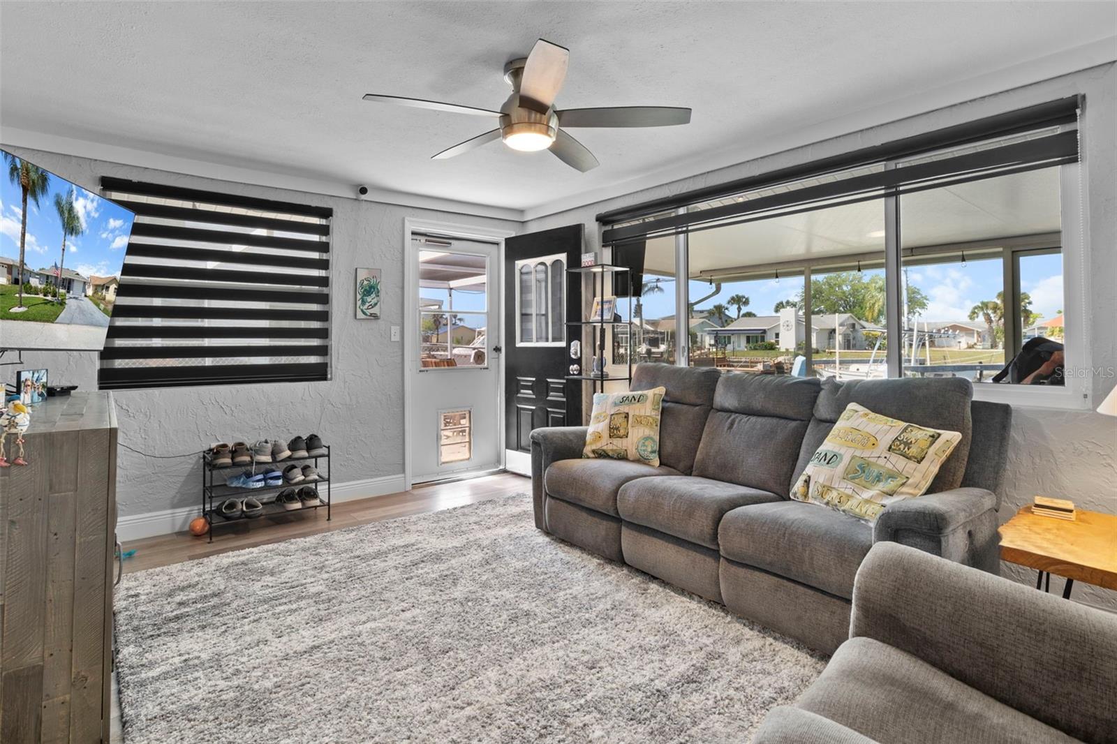 Family Room Overlooking Canal with NEW Flooring and 2019 Hurricane Impact Windows