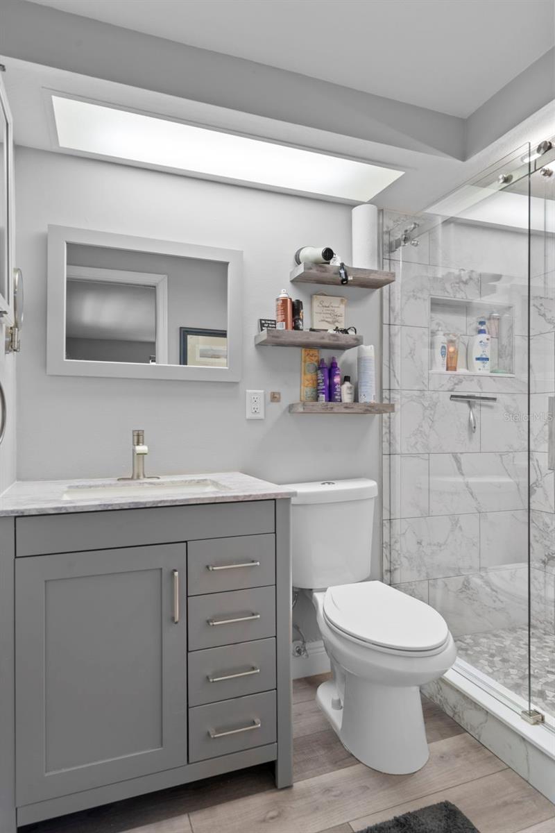 Primary Bath with NEW Vanity, NEW Toliet, NEW Tiled Shower