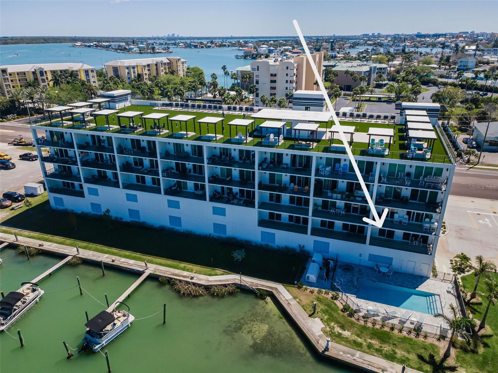 Unit #207 overlooking the Pool and the Waterfront!