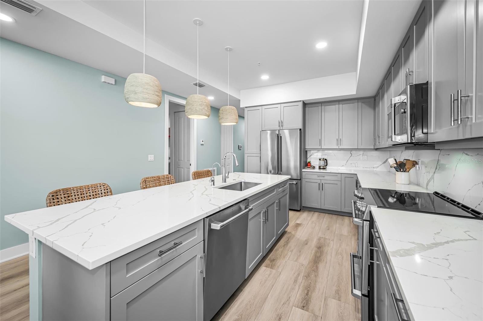 Refined modern kitchen anchored by a large center island