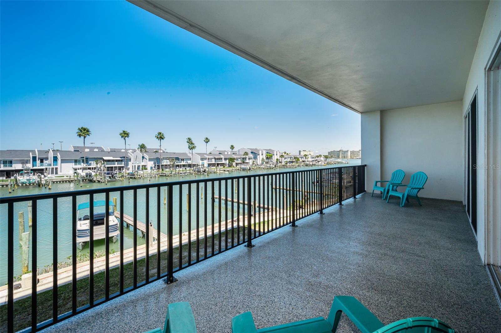Waterfront clubhouse with an open-air balcony overlooking the water