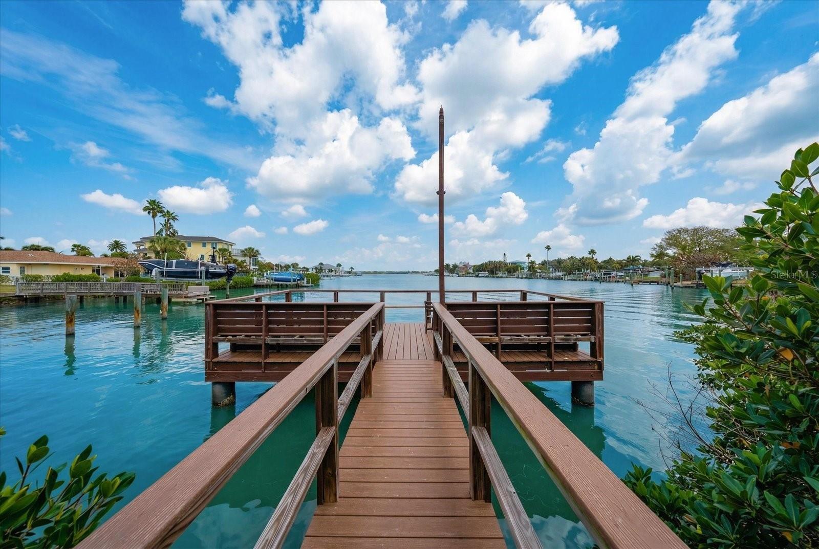 Become immersed in the surrounding nature and glistening waters of the canal on the community's private dock, offering picturesque views of the intracoastal.