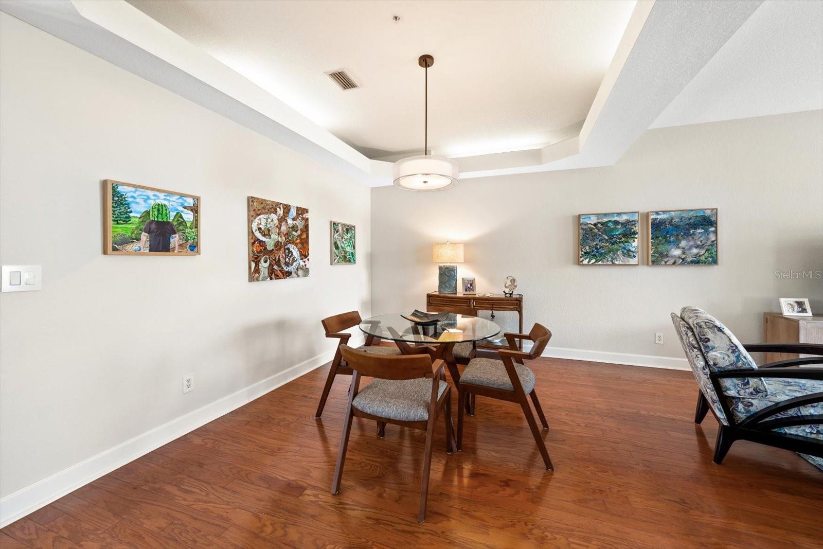 Refined lighting adds a polished touch to this dining space.