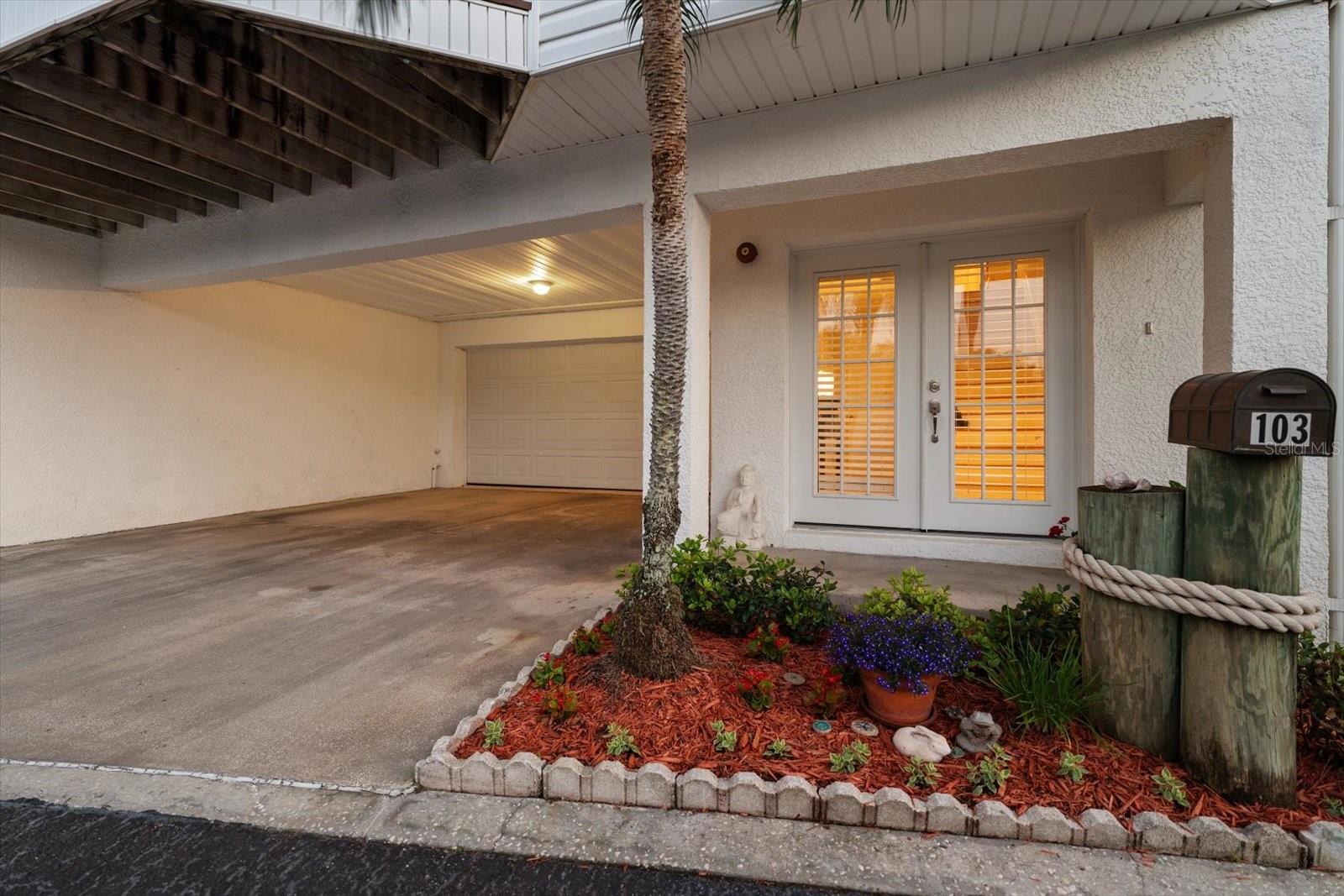 A gracious welcome, greets the owner and guests with an oversized two car garage, covered parking for two vehicles and double door entry into the ground level.