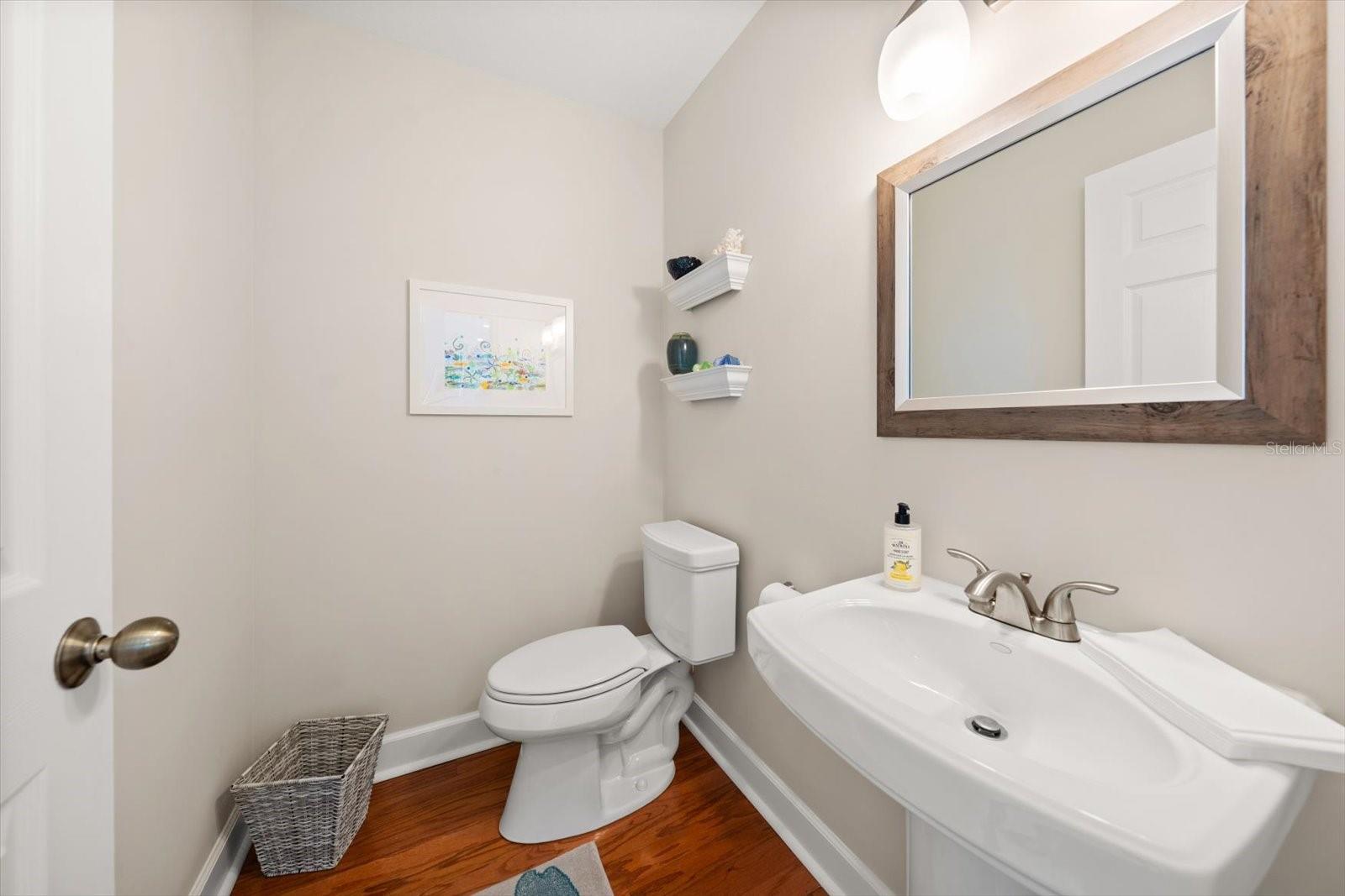 A half bath for guests is conveniently located on the main living level.
