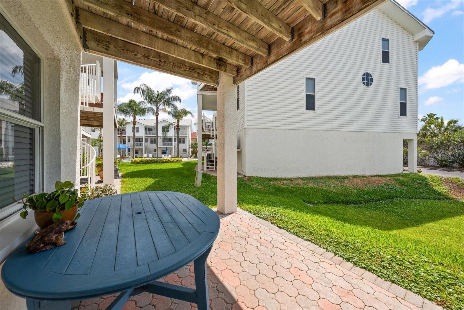 Covered patio accessed from the main living level, terrace, or garage.