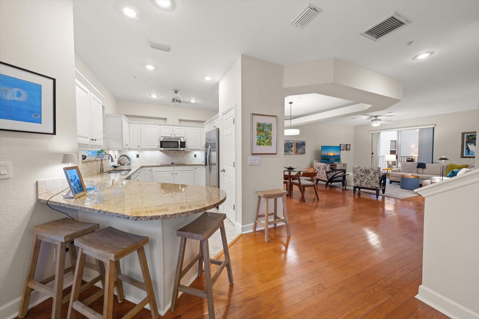 Experience effortless entertaining in this light-filled kitchen, boasting a wrap-around counter and a private breakfast nook overlooking the park.