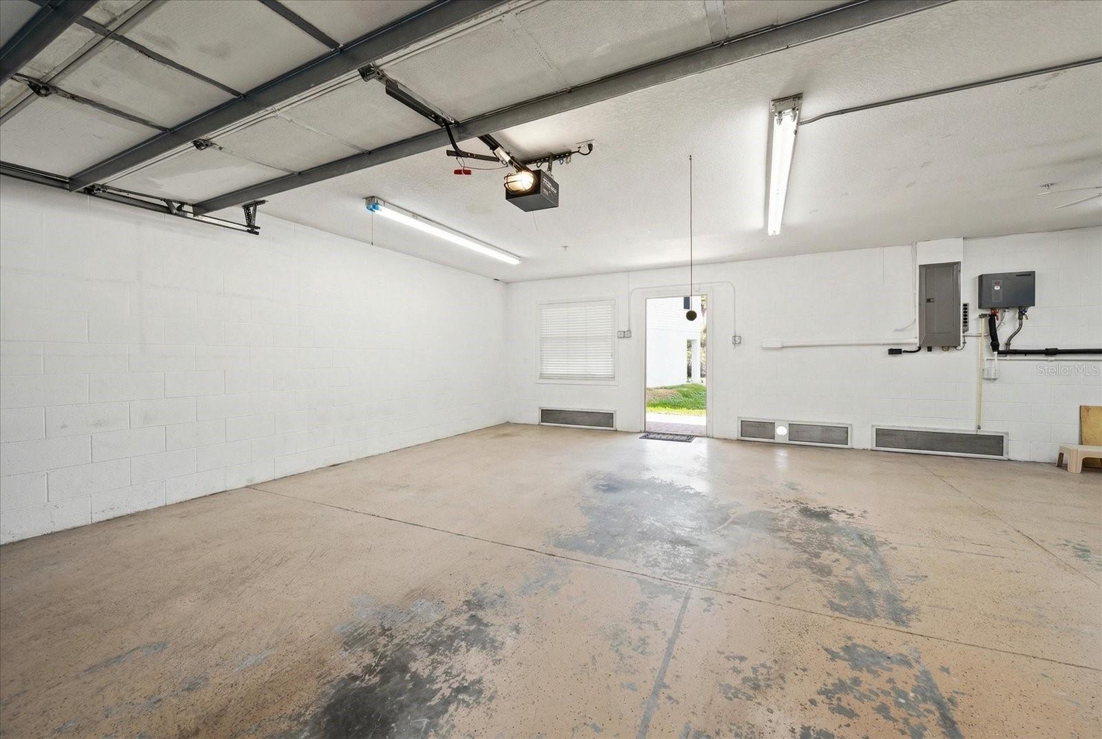 Oversized two car garage leads to the covered patio.