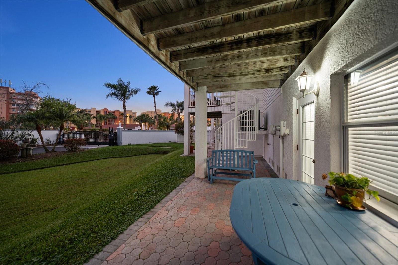 Enjoy the evenings from one of the several outdoor living areas of this home.