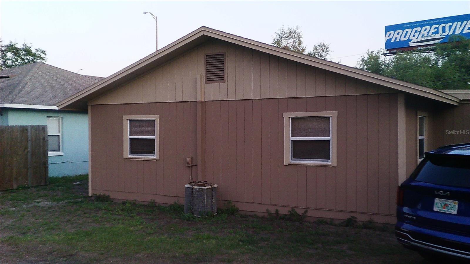 Back of house & AC unit!   Decent sized back yard