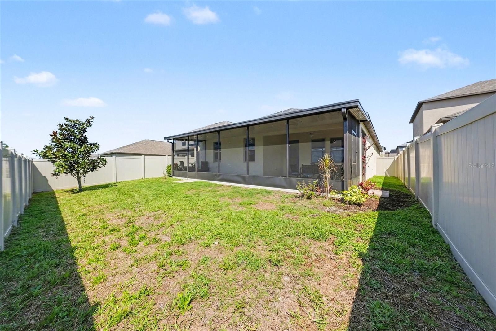 Spacious, fully fenced back yard.