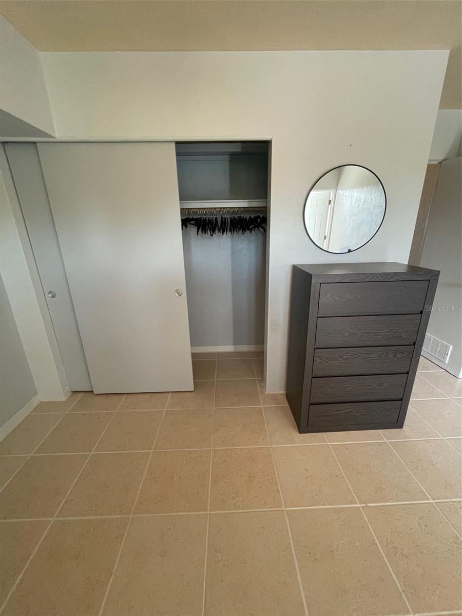 Bedroom with built in closet - dresser is yours if you like