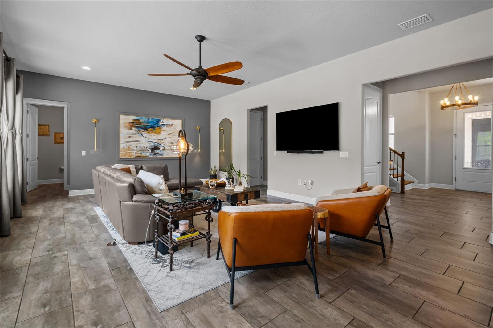 Spacious great room filled with natural light and views of the backyard.