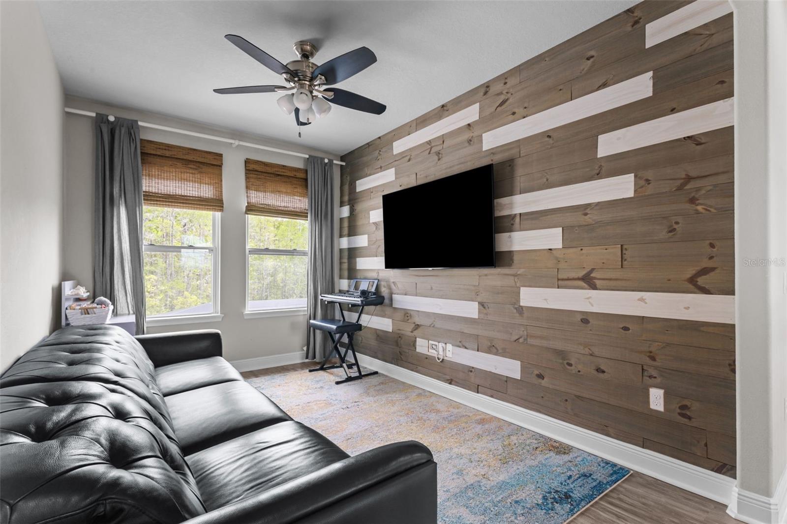 Upstairs loft offering a flexible second living or media space.