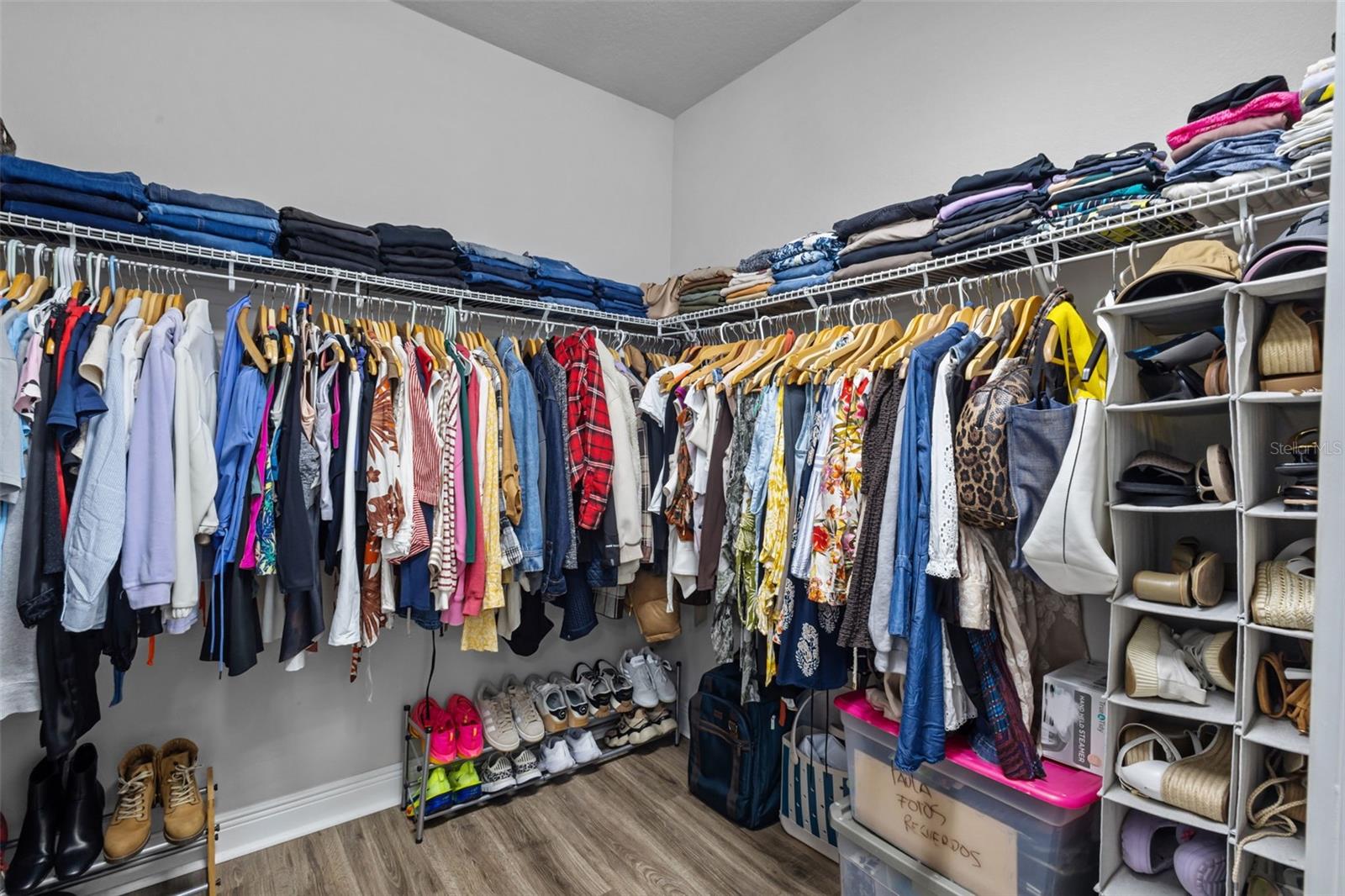 Walk-in closet offering generous storage.