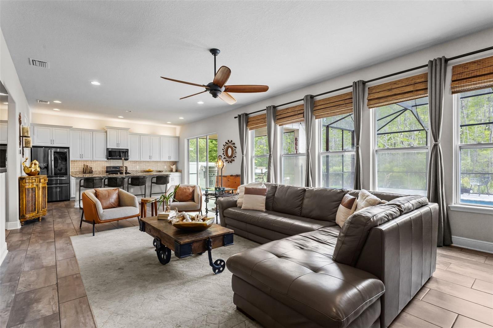 Spacious great room filled with natural light and views of the backyard.