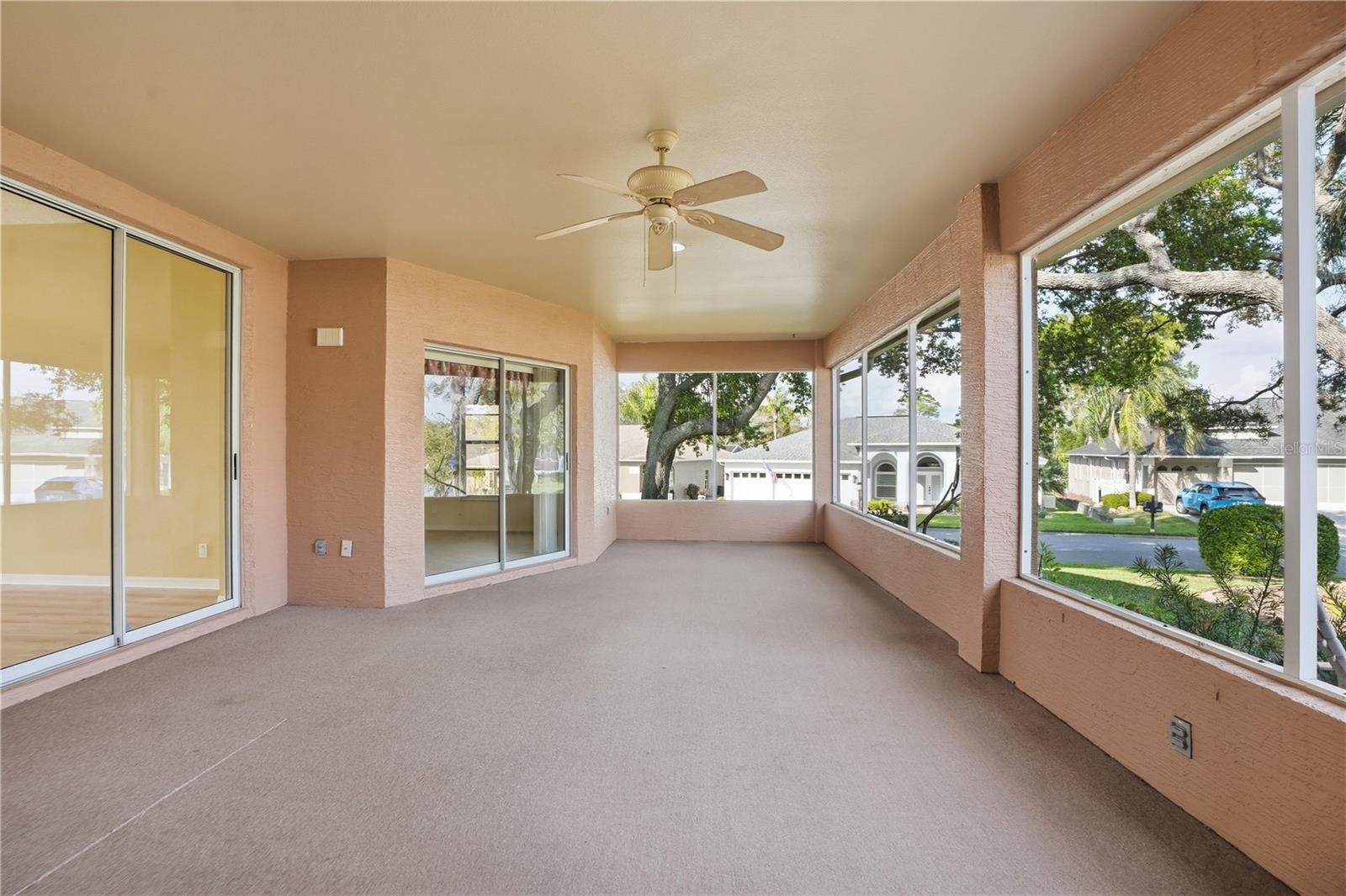 Extra large lanai, with access from the primary bedroom, formal sitting area and living room.