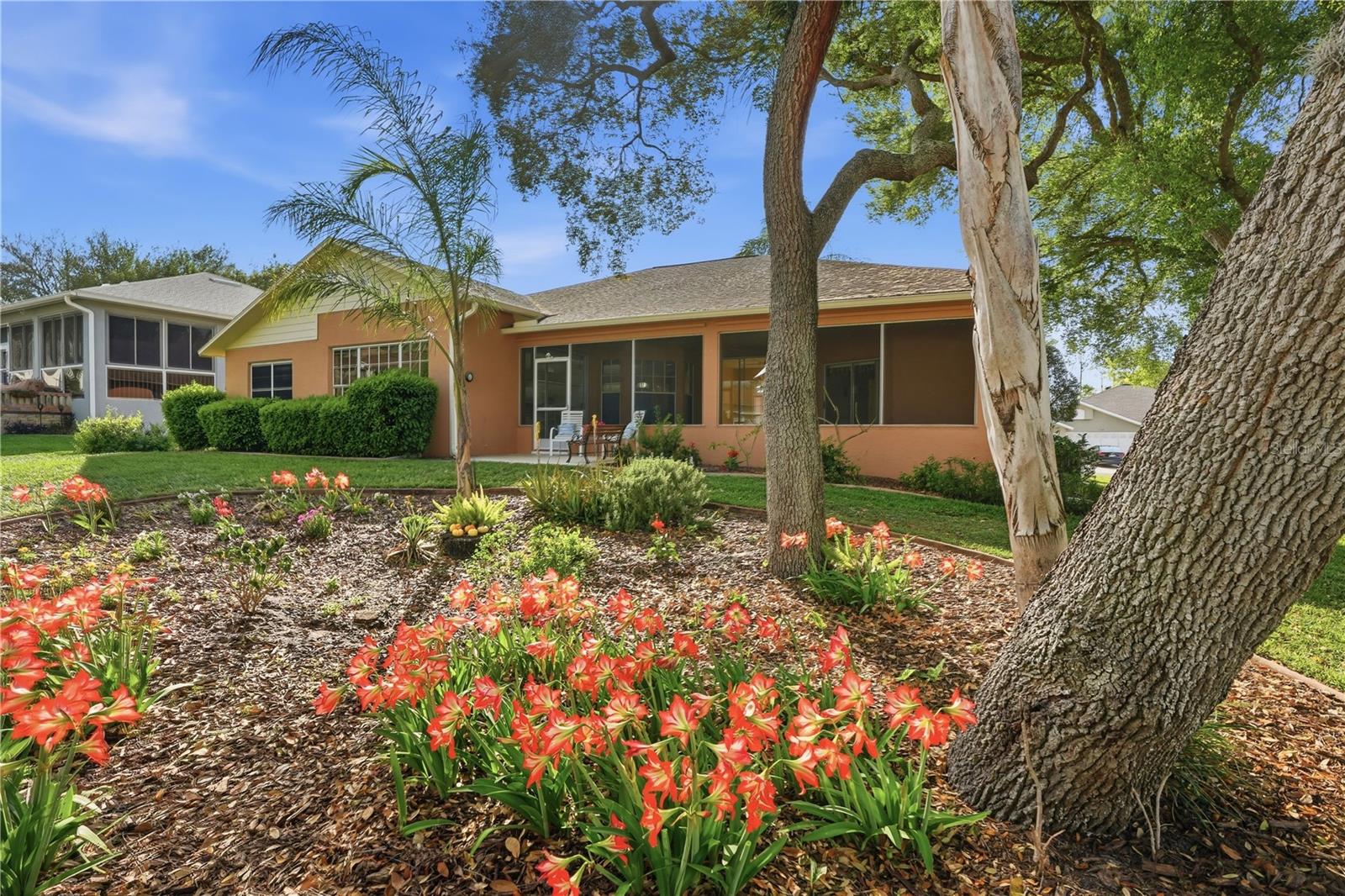 Mature landscaping with garden.