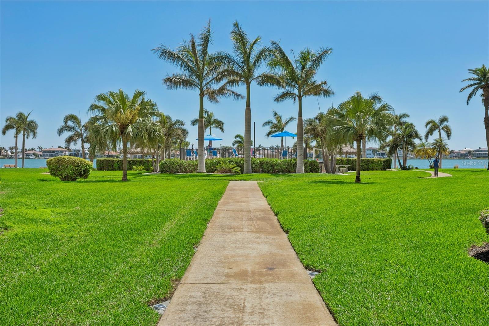 View of pool between bldgs. 2&3, gas grills also
