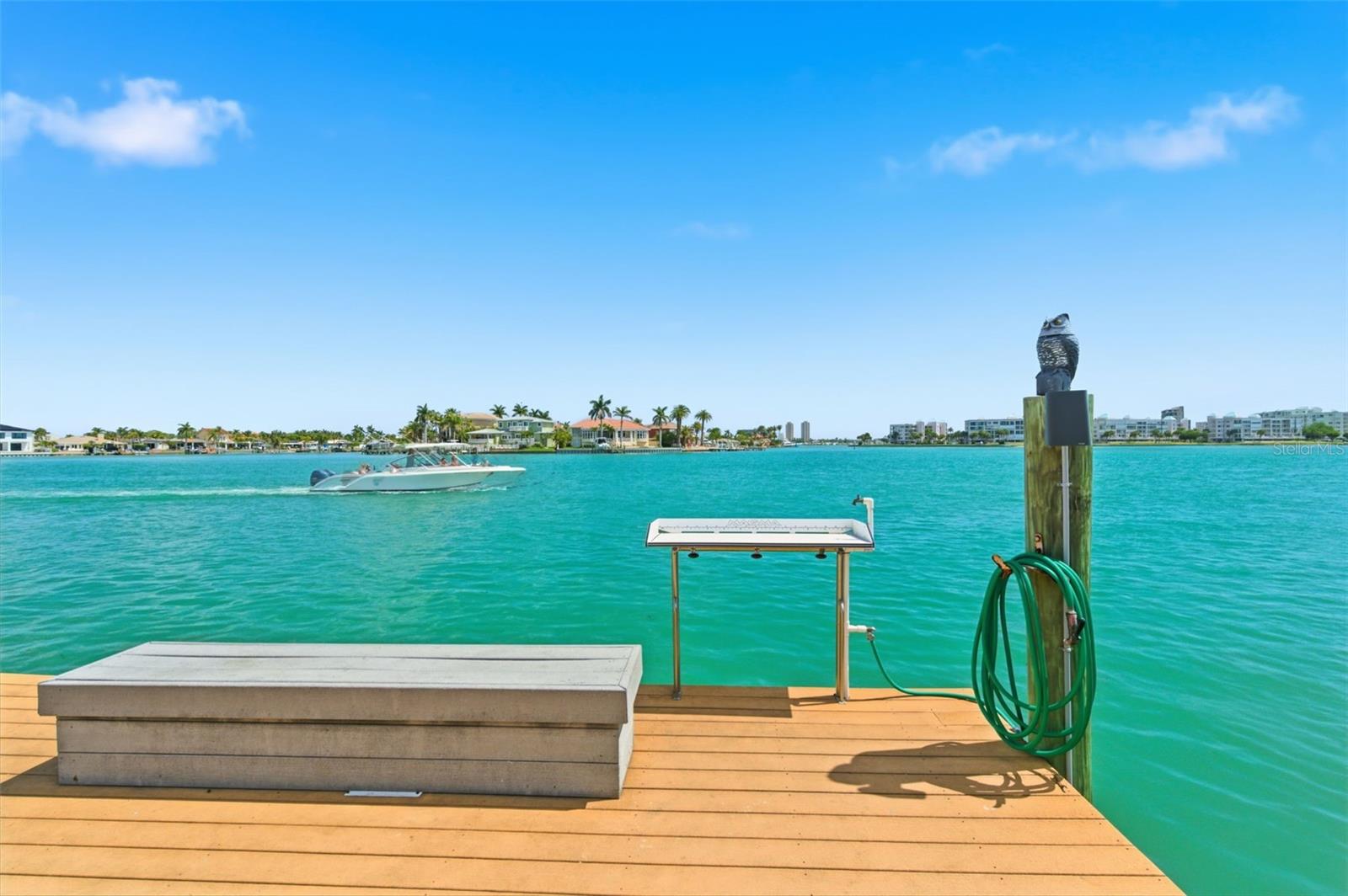 Nice fishing dock with cutting table, water and lights at night