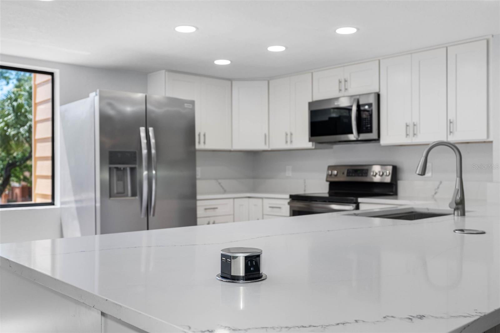 Pop-up outlets and charging receptacles.