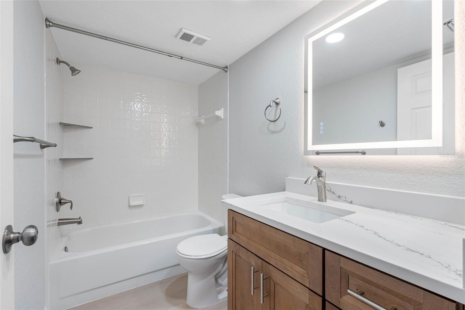 Guest bathroom with shower and tub.