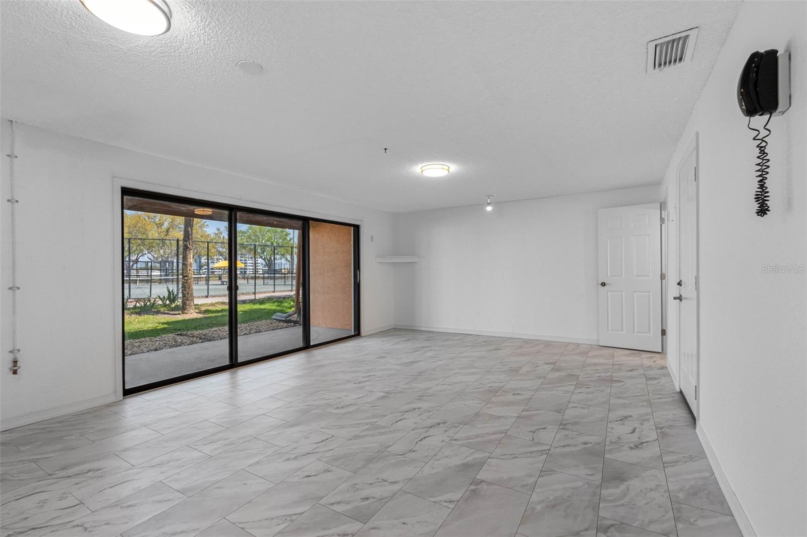 Large bonus room with tile flooring.