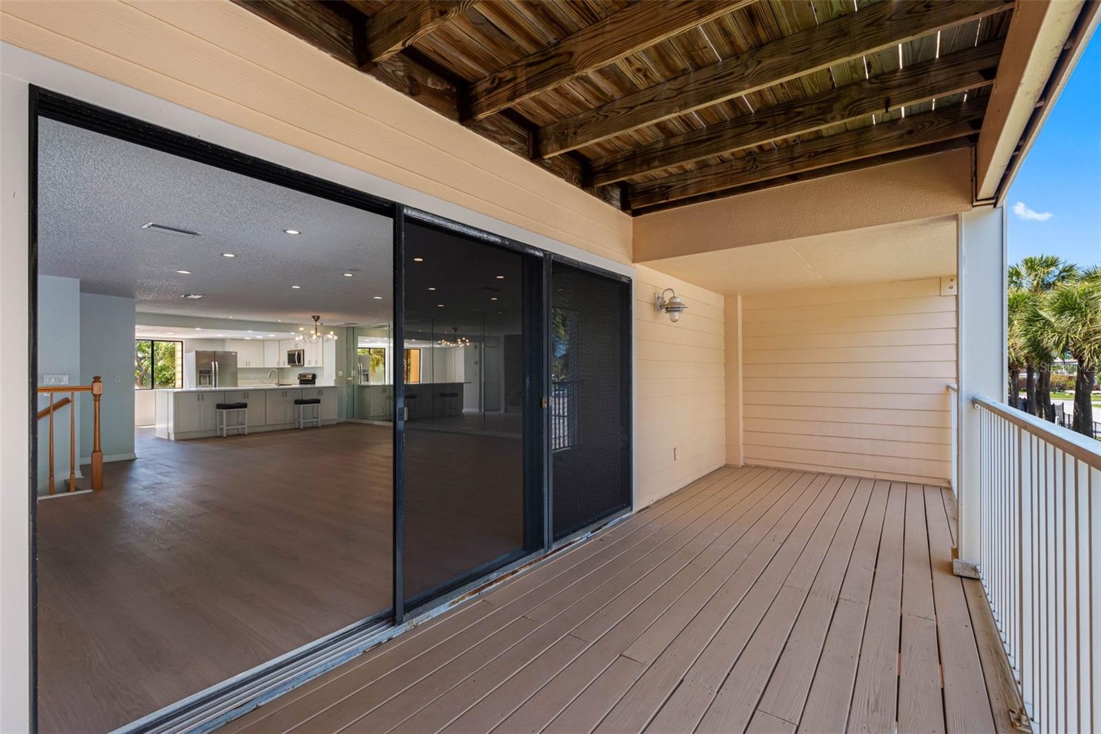 Second floor balcony is covered.