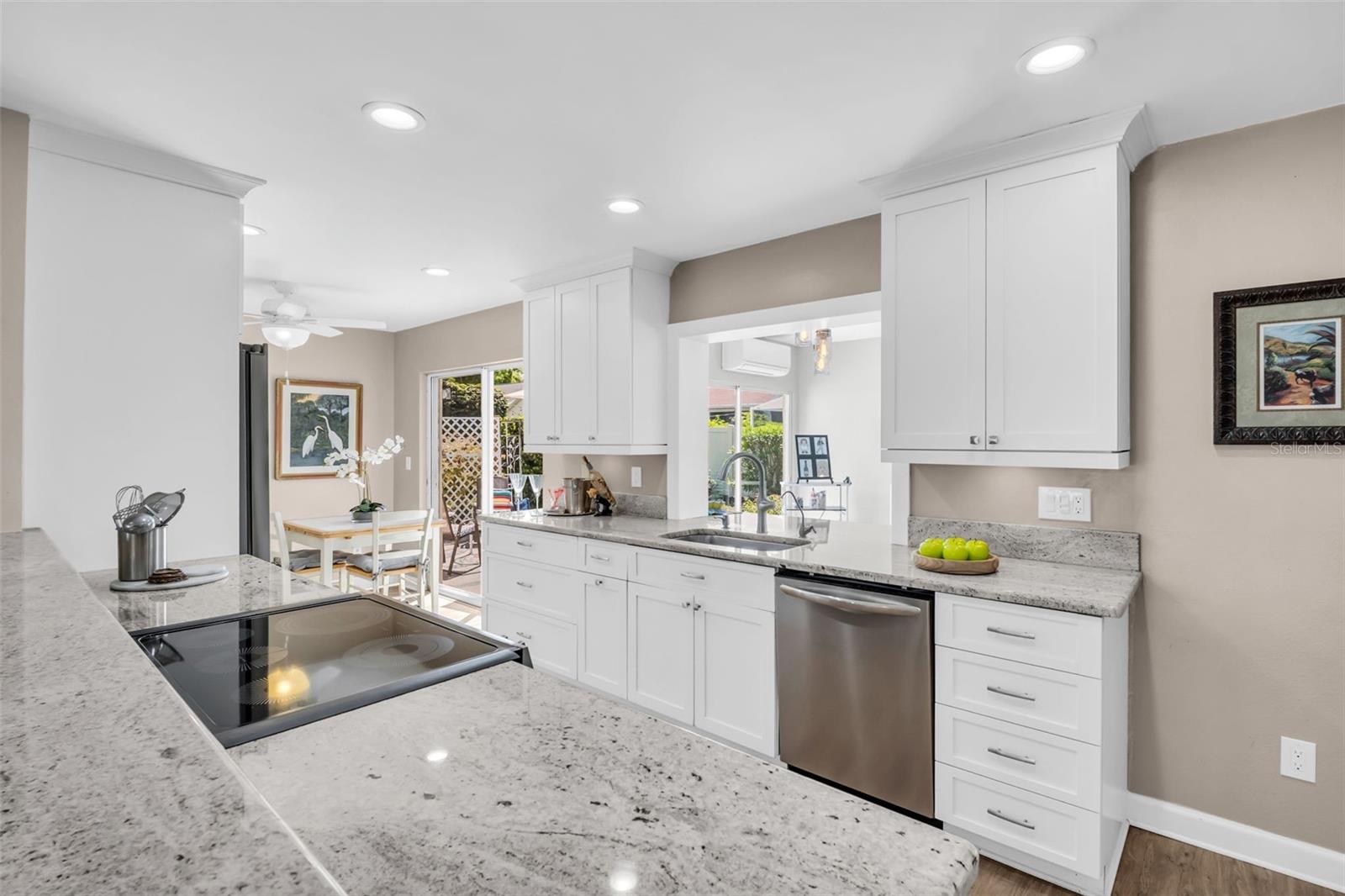 Granite countertops, updated solid wood soft close cabinetry, sleek stainless appliances~